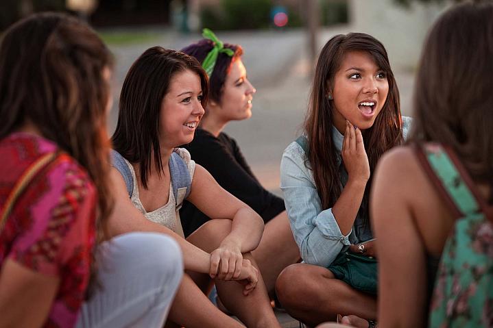 Group of teenagers sitting outside Group of teenagers sitting outside.