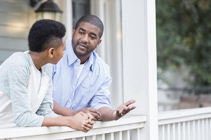 Father talking with his son on the porch Father talking with his son on the porch