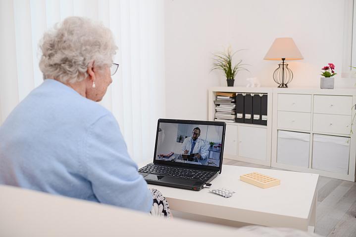 Older adult talking with her doctor on a computer screen Older adult talking with her doctor on a computer screen