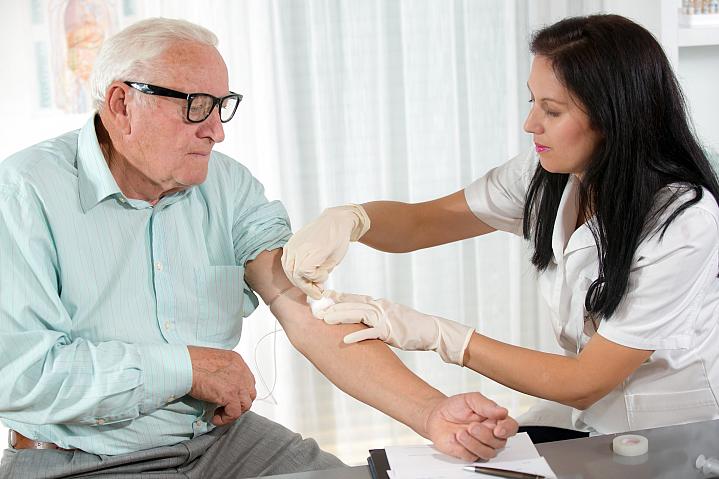 Older man getting his blood drawn