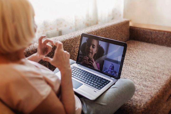 Older woman video chatting with a young girl Older woman video chatting with a young girl