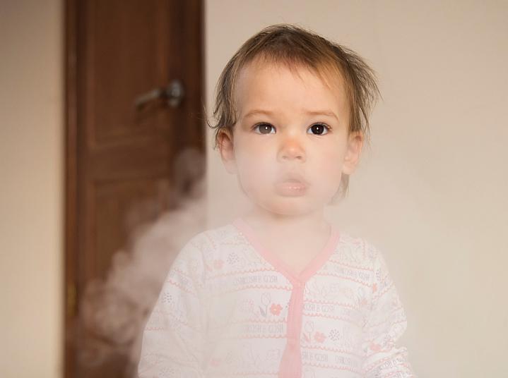 Young girl in a cloud of cigarette smoke Young girl in a cloud of cigarette smoke